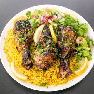Large plate Jerk Chicken over rice and salad